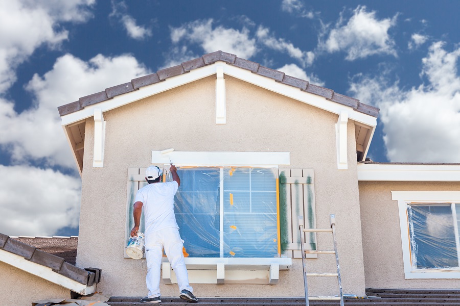 Professional,House,Painter,Painting,The,Trim,And,Shutters,Of,A